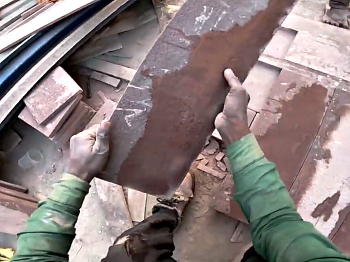 Handling lengths of steel reinforcement on site.