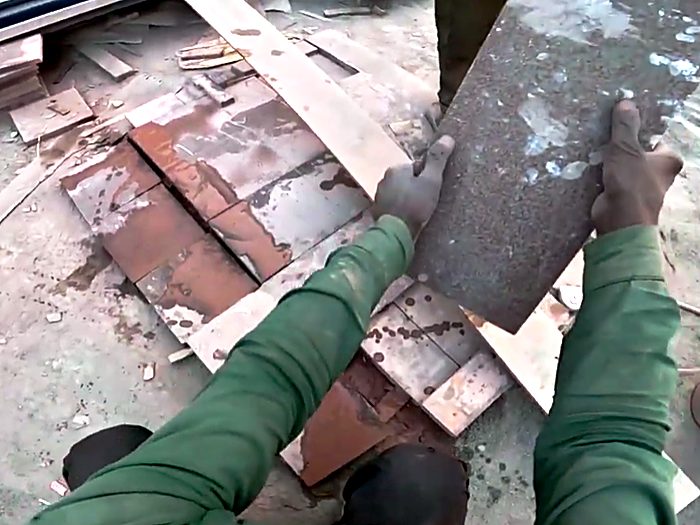 Moving a steel beam across rough ground.